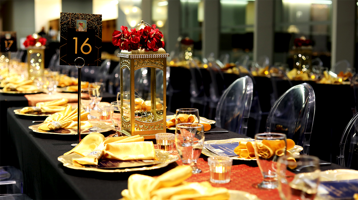 A long dinner table set for an elegant meal.